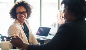Image: African American women talking Topic: Supporting black-owned business