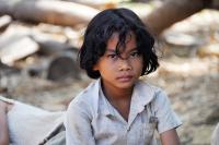 Image: sad child. Title: Stop Sweatshops and Child Labor