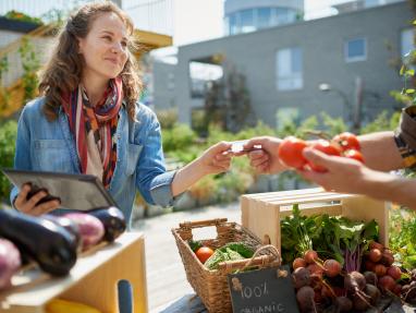 woman buying from market