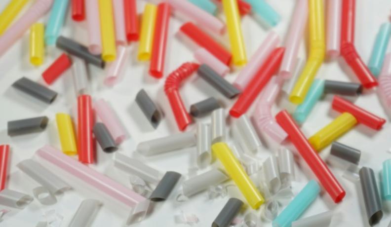 A close up shot of different colored straws that have been cut into smaller and smaller pieces.