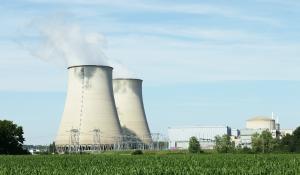 Image: nuclear energy plant smokestacks emitting pollution.