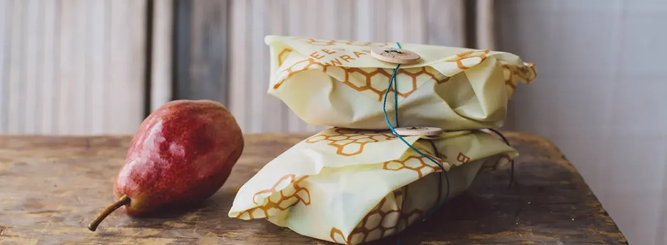 beeswrap sandwiches and a pear