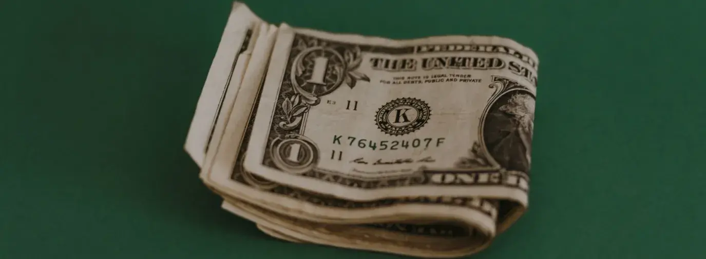 cash on a green table