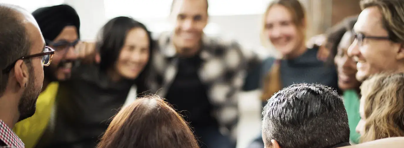 Image: group of diverse people in circle. Topic: 10 Ways to Build Community
