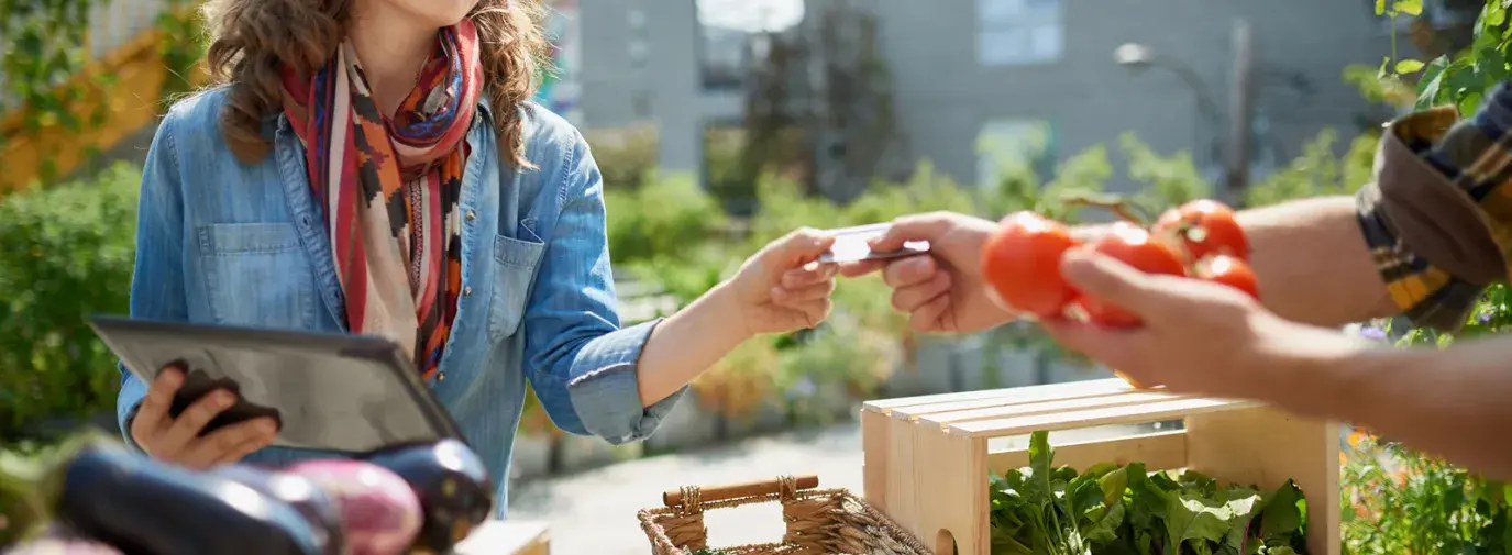 woman buying from market